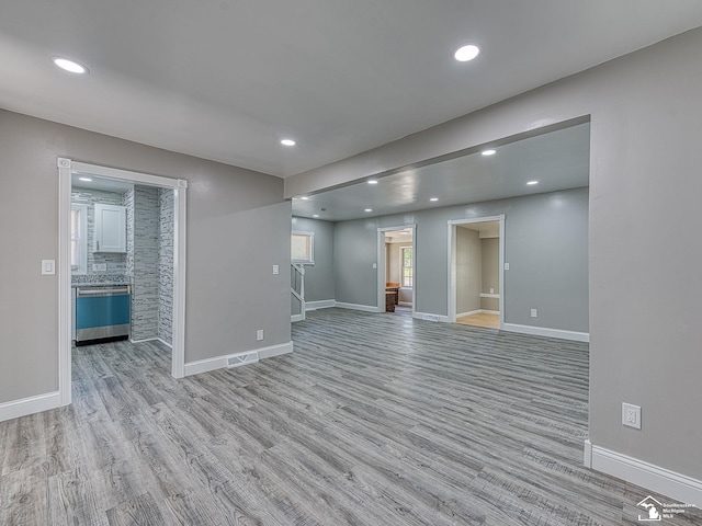 spare room featuring light wood-type flooring