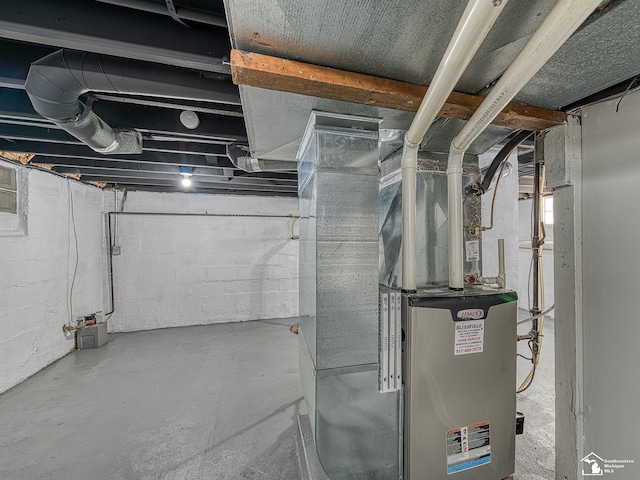 utility room featuring heating unit