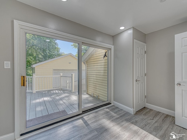 doorway to outside with light hardwood / wood-style floors