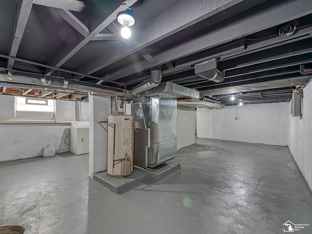 basement featuring washer / clothes dryer, gas water heater, and heating unit