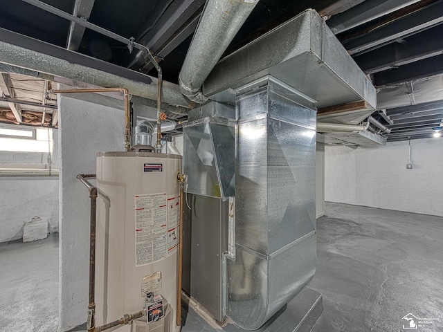 utility room with heating unit and gas water heater