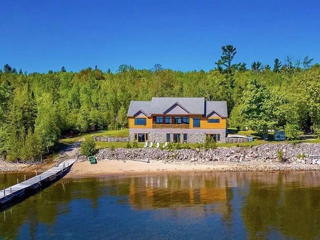 rear view of property featuring a water view