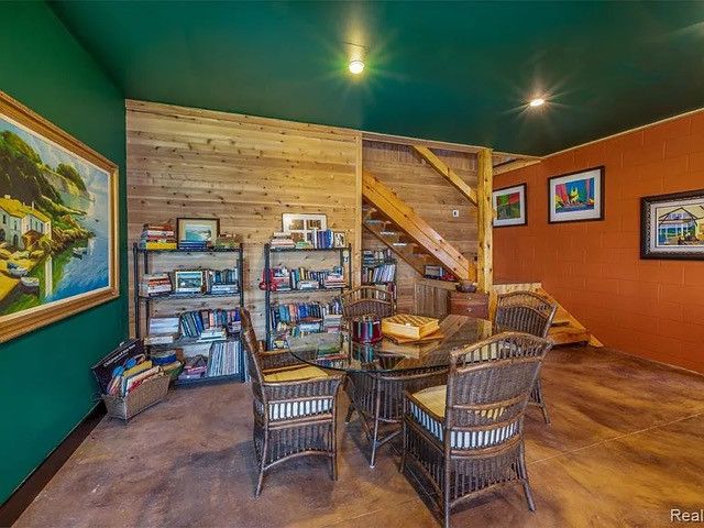 dining space featuring concrete flooring