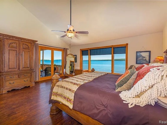 bedroom with lofted ceiling, dark hardwood / wood-style flooring, access to exterior, ceiling fan, and a water view