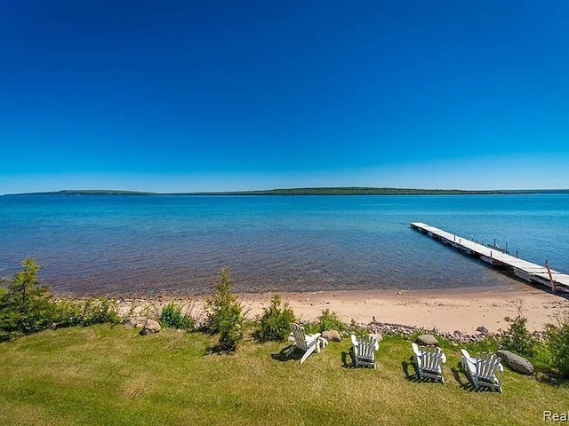 exterior space featuring a view of the beach and a water view