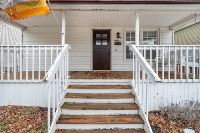 entrance to property with a porch