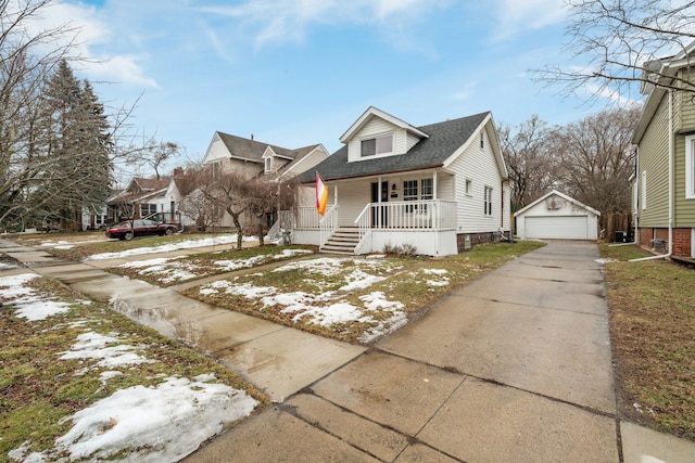 bungalow-style home with a garage, an outdoor structure, and a porch