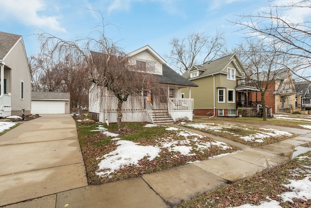 view of front of home featuring a garage and an outdoor structure