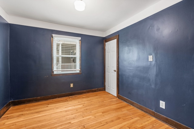 spare room featuring light hardwood / wood-style flooring