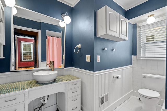 bathroom with sink, tile patterned floors, and toilet