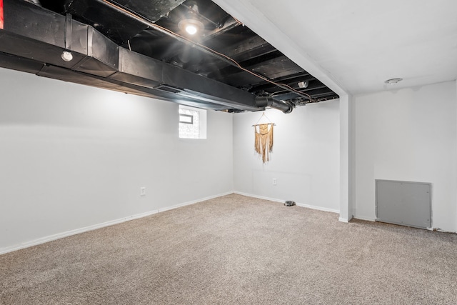 basement featuring carpet flooring