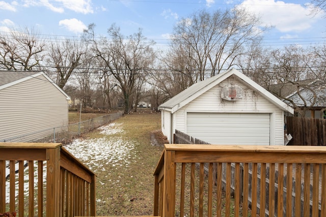 view of yard featuring an outbuilding and a garage