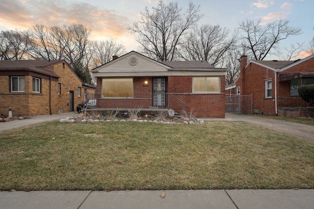 view of front of home featuring a lawn