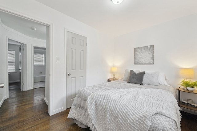 bedroom featuring dark hardwood / wood-style flooring