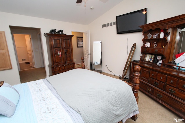 bedroom with lofted ceiling, light carpet, and ceiling fan