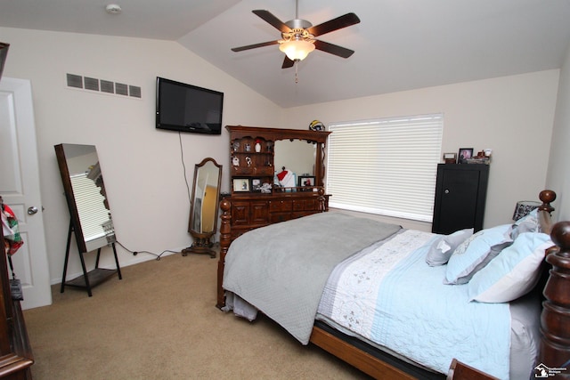 carpeted bedroom featuring vaulted ceiling and ceiling fan