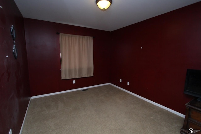 spare room featuring carpet