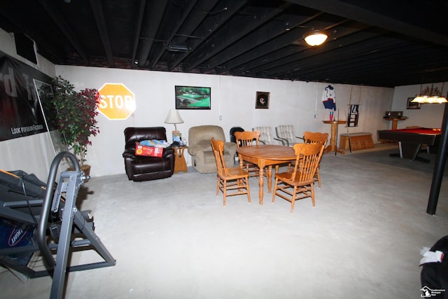 dining room featuring pool table and concrete floors