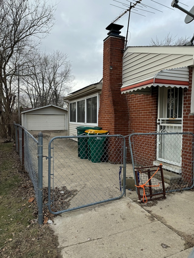 view of home's exterior with an outbuilding and a garage