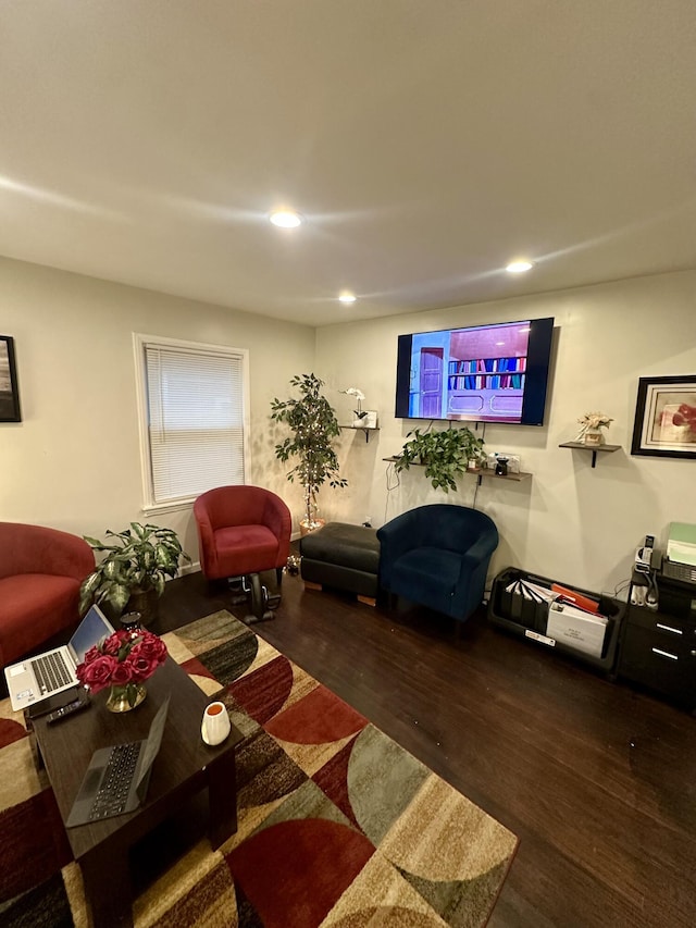 living room with dark hardwood / wood-style flooring