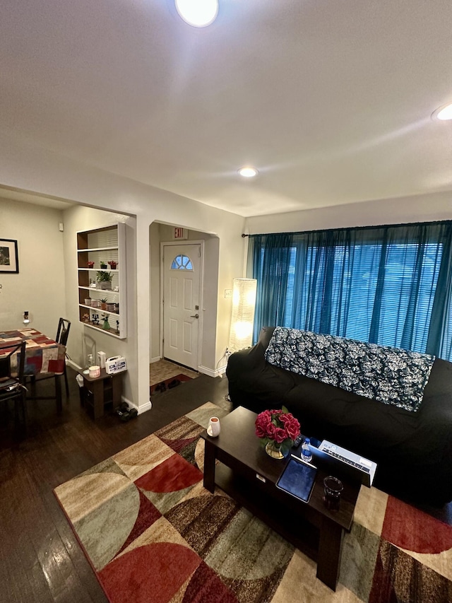 living room with dark hardwood / wood-style floors