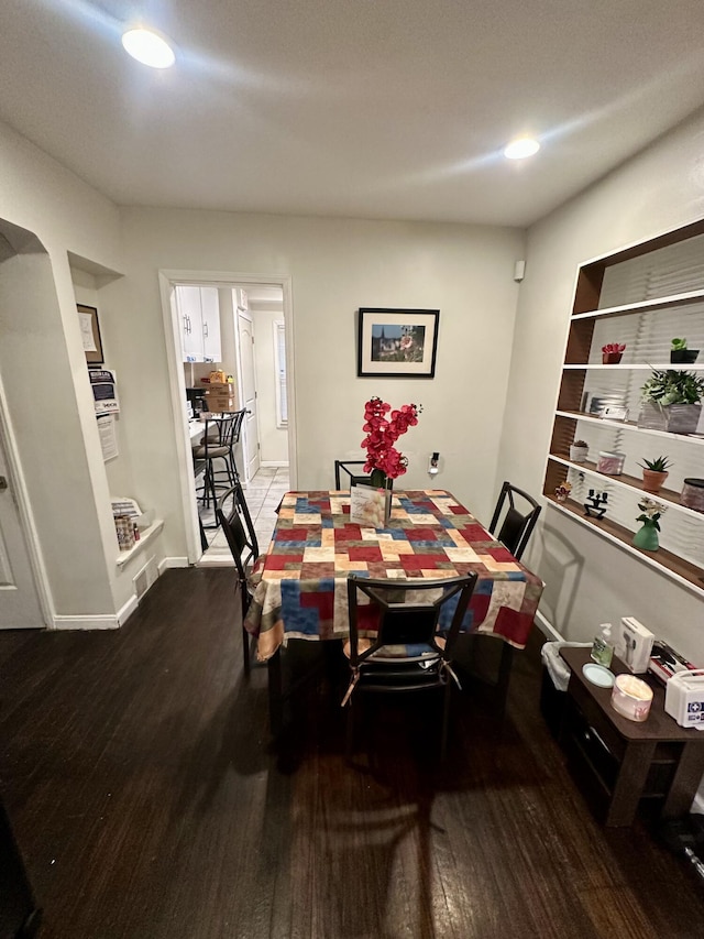 dining room with hardwood / wood-style floors