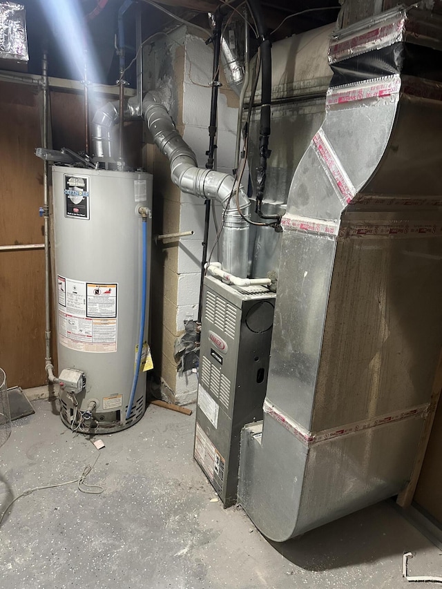 utility room with gas water heater