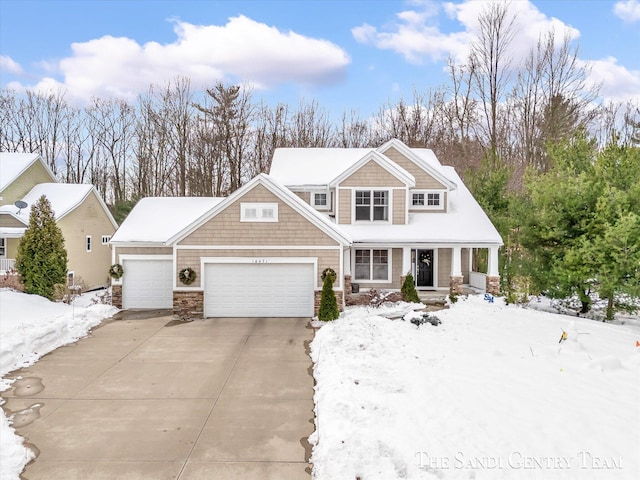 view of front of home with a garage and a porch