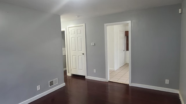 spare room with hardwood / wood-style floors