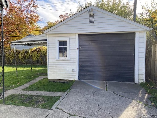 garage with a lawn