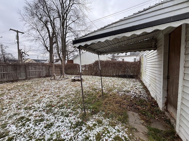 view of yard layered in snow