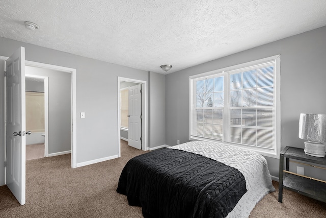 bedroom with a textured ceiling and carpet