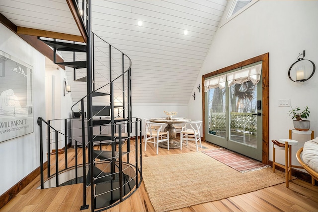 interior space featuring wood-type flooring and vaulted ceiling