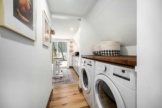 washroom featuring independent washer and dryer and light wood-type flooring