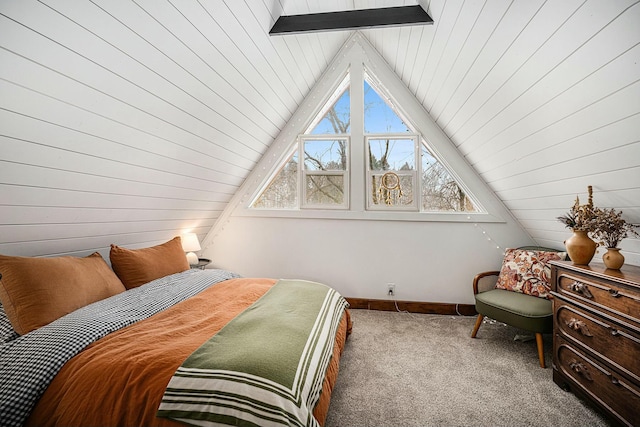 bedroom with vaulted ceiling with beams and carpet