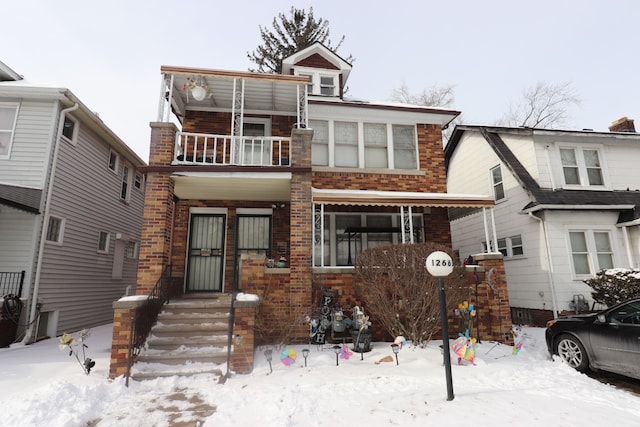 view of front of house with a balcony