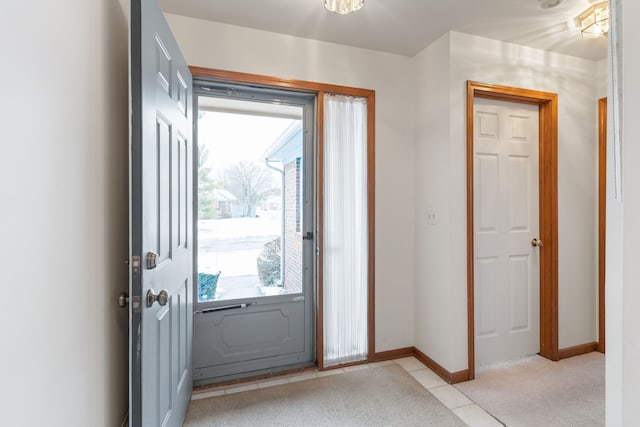 doorway featuring light carpet