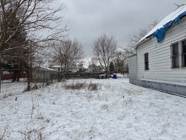 view of yard covered in snow