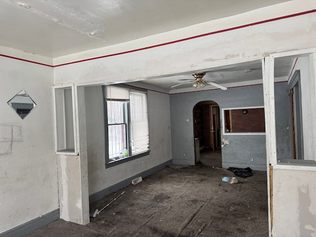 interior space featuring ceiling fan