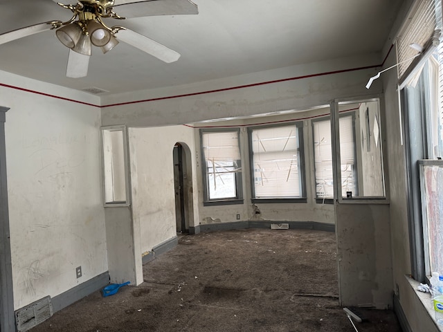 empty room featuring ceiling fan