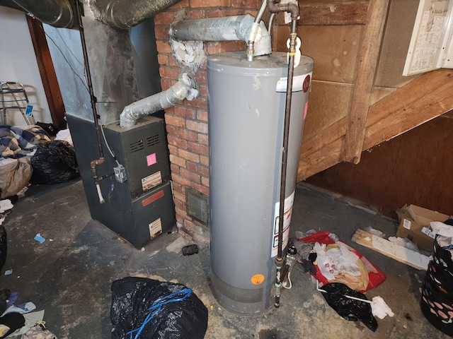 utility room featuring water heater