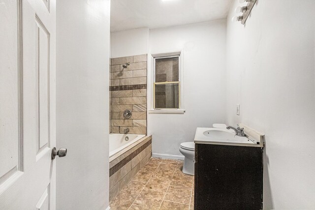1003 Lavette Ave, Benton Harbor, MI 49022 - full bathroom featuring vanity, tiled shower / bath, and toilet