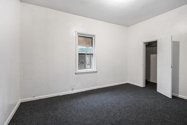 1003 Lavette Ave, Benton Harbor, MI 49022 - empty room featuring dark colored carpet