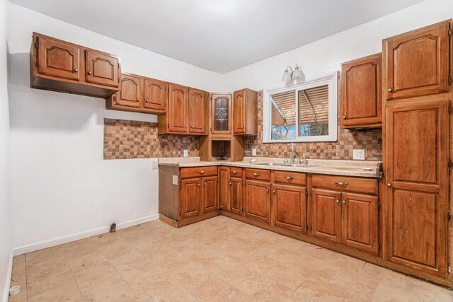 1003 Lavette Ave, Benton Harbor, MI 49022 - kitchen featuring tasteful backsplash and sink