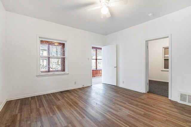 1003 Lavette Ave, Benton Harbor, MI 49022 - empty room featuring ceiling fan and dark hardwood / wood-style flooring