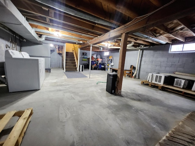 basement featuring washing machine and clothes dryer