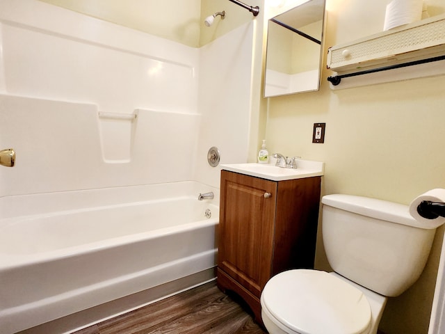 full bathroom with vanity, toilet, shower / bath combination, and hardwood / wood-style floors