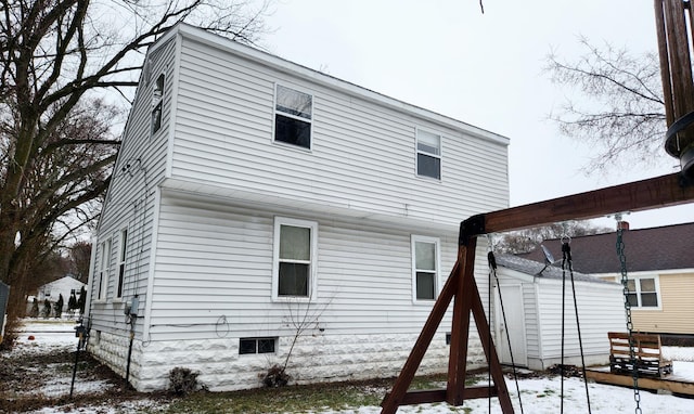 view of snow covered house