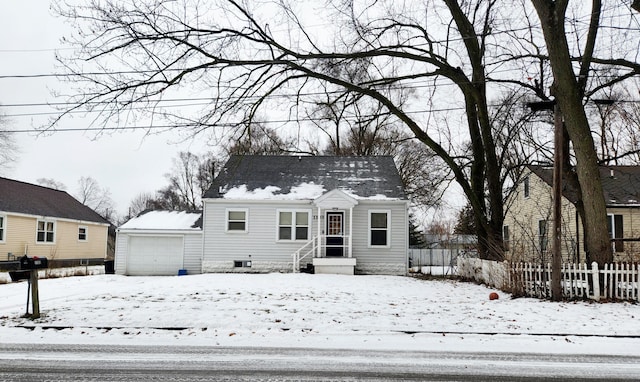 view of front of house with an outbuilding and a garage