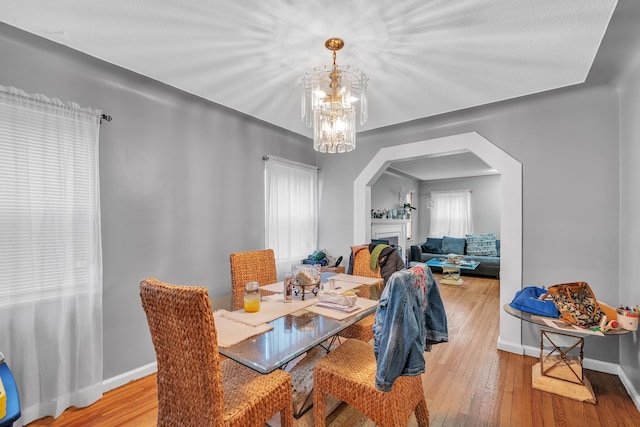 dining room featuring a notable chandelier and light hardwood / wood-style floors